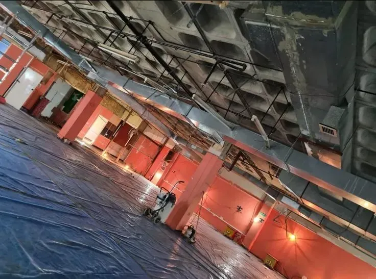 Professional asbestos removal site preparation in a commercial building by Stay Safe Environmental.